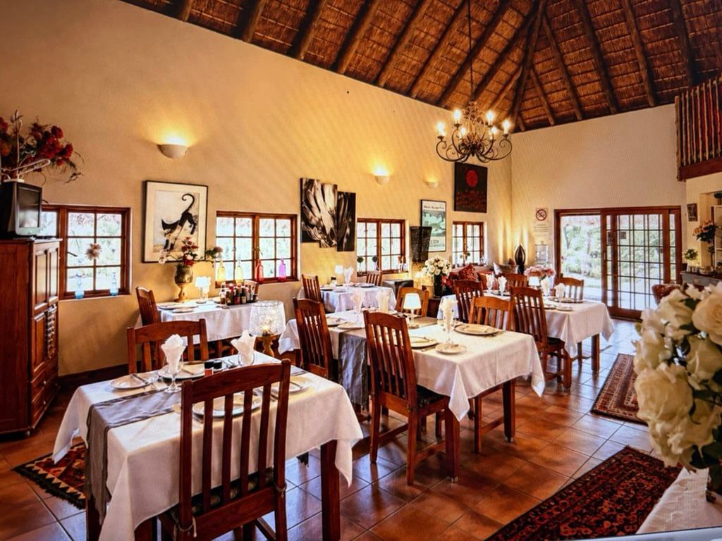 The dining room, with tables laid for breakfast